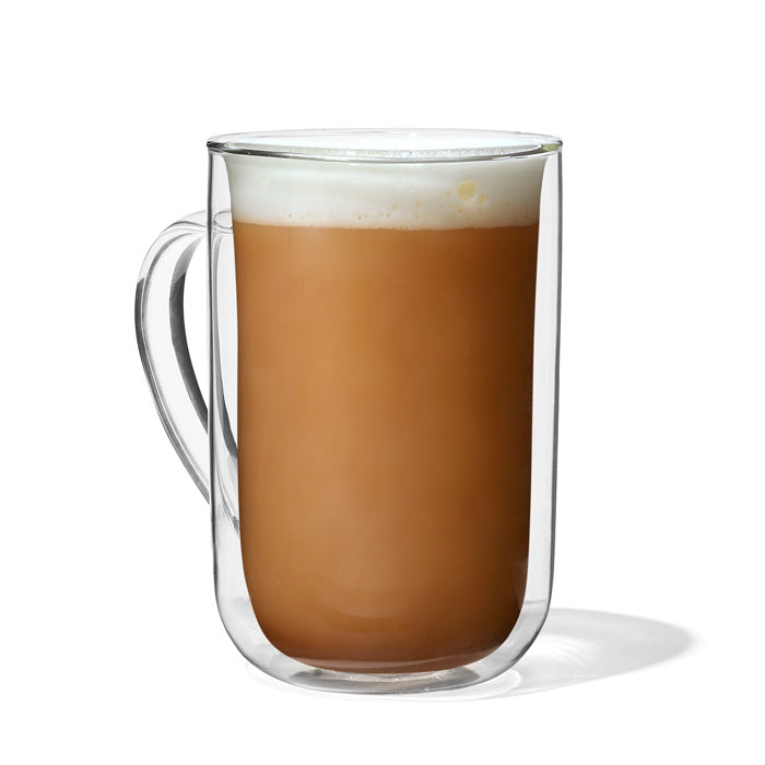 Glass mug of prepared Caramel Apple tea with a light amber colour